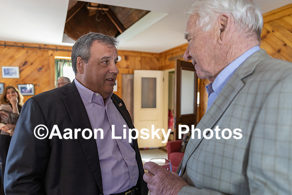 Chris Christie talks with Greg Johnson of Swanzey at house party at Jane Lane's house in Keene on Friday-7453