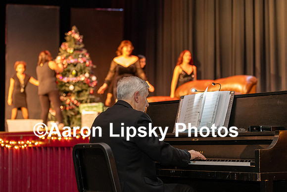 MRHS Chorus Director Mark Polifrone plays the piano for a vocal skit by the chorus at the Holiday Concert at MRHS Saturday Dec 16, 2023-0394
